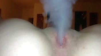 Slutty blonde smokes cigarette with her pussy