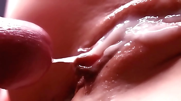 cum between her labia. Close-up