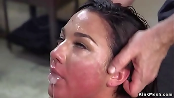 Brunette slave handled with anal training