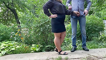 Hot MILF in short skirt helps man give golden shower