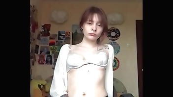She took off her underwear on camera and showed a smooth pussy.